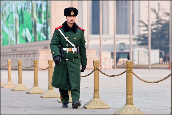 Honor guard marches close to the mausoleum of Mao Zedong