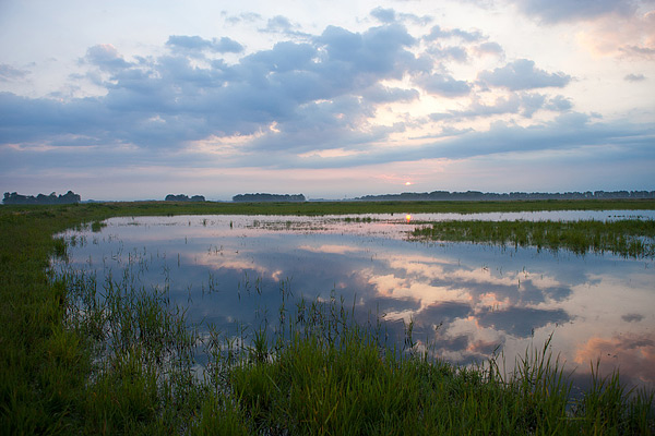 Zonsopkomst boven Schokland Zonsopkomst boven Schokland