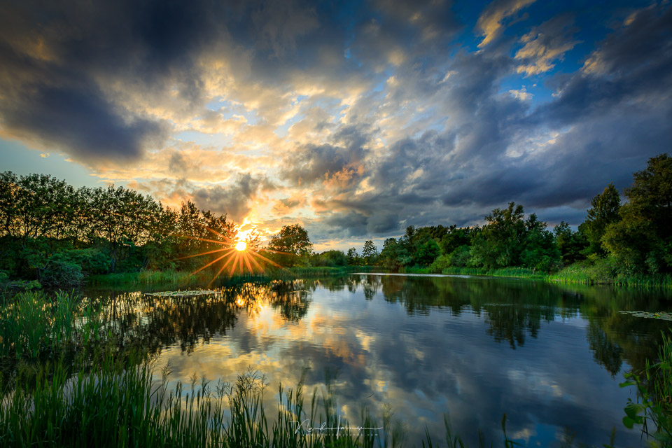 Nando zonsondergang visvijver