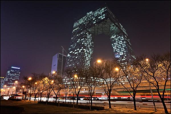 CCTV headquartes with traffic light trails