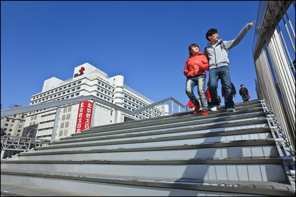 Young Chinese couple on stairs