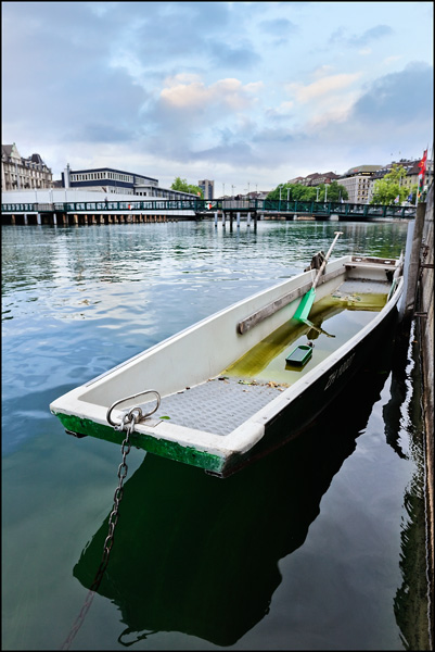 moored flat bottom boat in Zurich old town moored flat bottom boat in Zurich old town